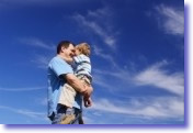 Father showing love toward his child in open sky - Harmonic Thought - www.YourAttitudeWillMakeYou.com