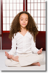 Young girl in white suit peacefully meditating in front of Japanesse style window - Harmonic Thought - www.YourAttitudeWillMakeYou.com